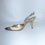 Side view of Dolce & Gabbana Gold Python Heels featuring a pointed toe, slingback strap, metallic gold leather trim and slim stiletto heel.
