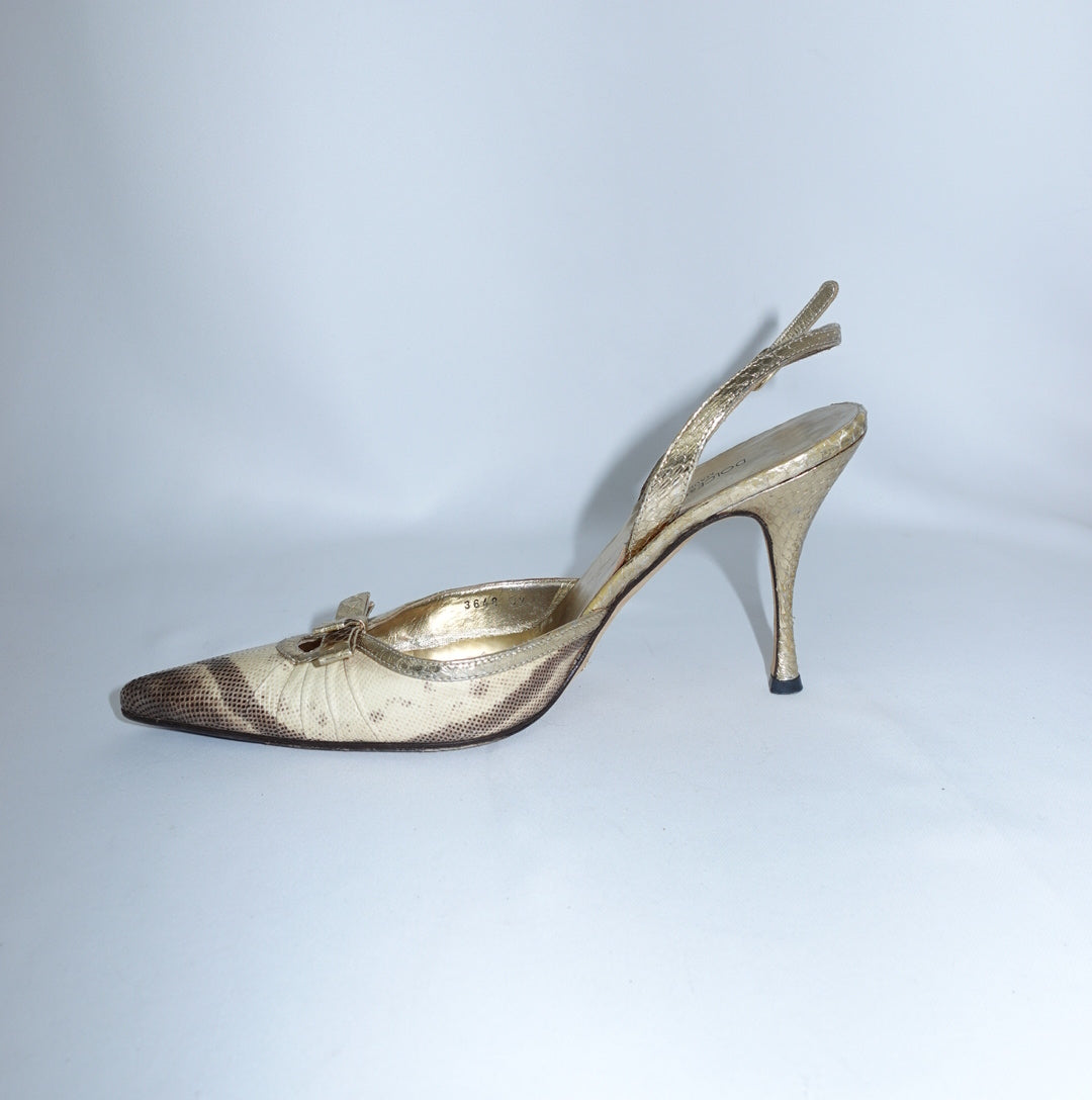 Side view of Dolce & Gabbana Gold Python Heels featuring a pointed toe, slingback strap, metallic gold leather trim and slim stiletto heel.