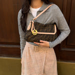 Vintage Fendi Chef Zucca shoulder bag worn on the shoulder, featuring the signature FF monogram and timeless Y2K designer style.