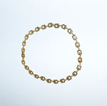 Vintage Givenchy gold-toned geometric logo link necklace still life showing polished chain design