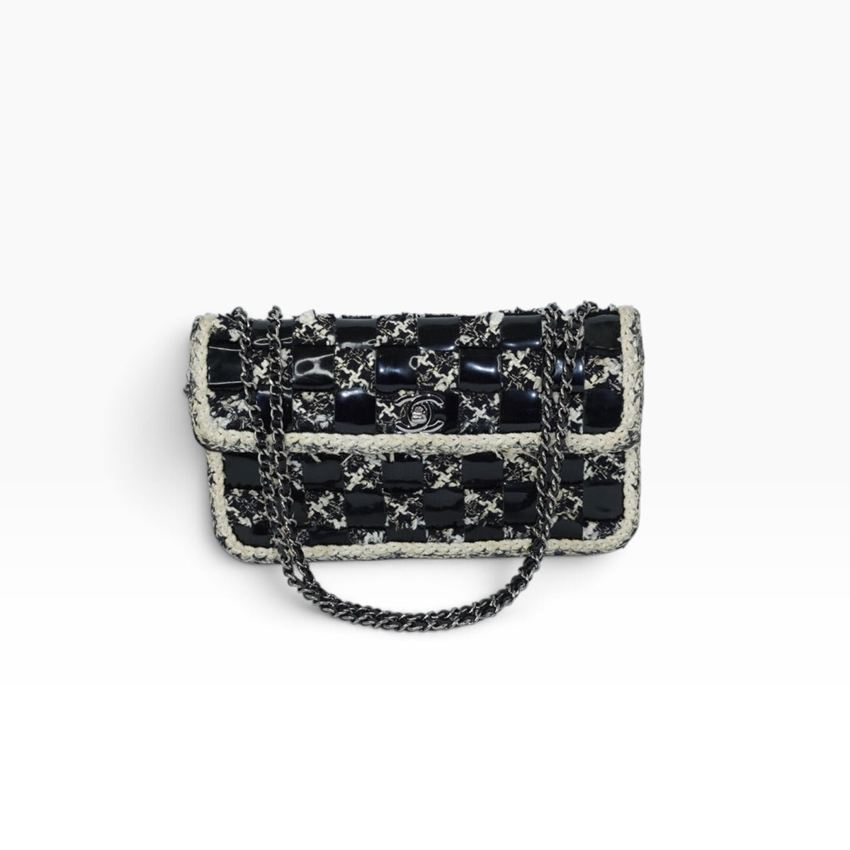 My Vintage Attire Chanel chessboard flap bag in black patent leather and tweed with silver CC turn-lock hardware.