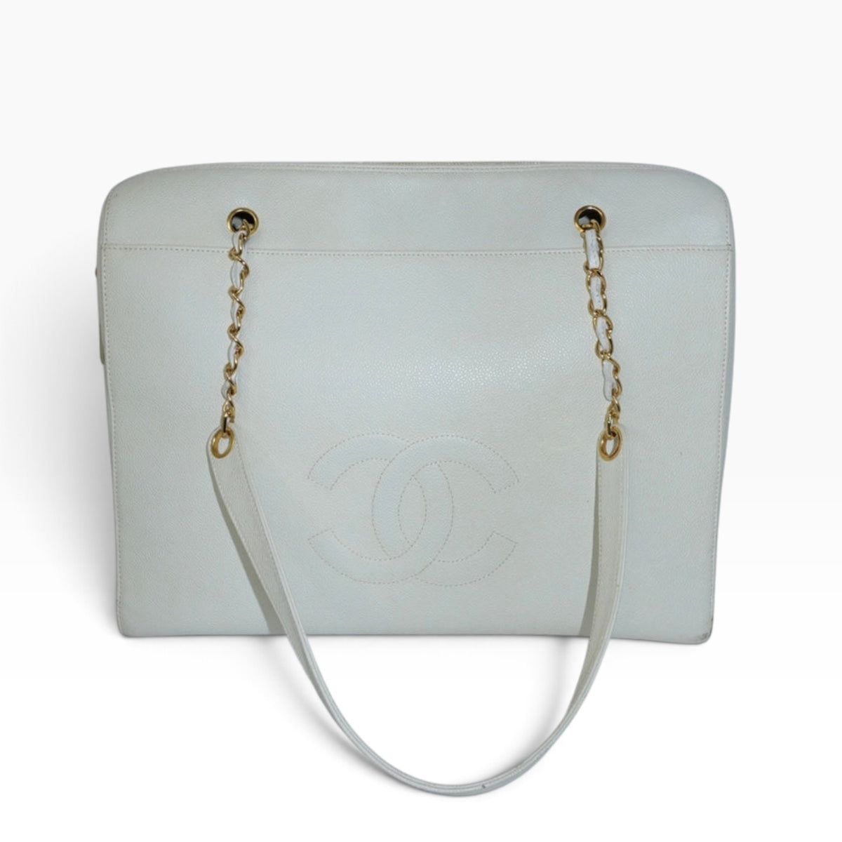 My Vintage Attire Chanel Maxi tote in white caviar leather with embossed CC logo and gold chain shoulder straps.