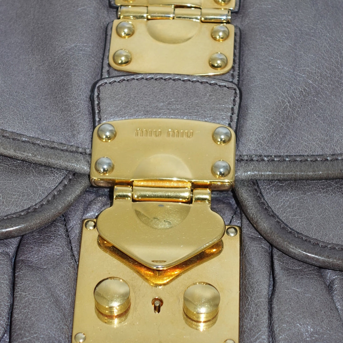 My Vintage Attire Miu Miu grey matelassé lambskin shoulder bag with gold-tone hardware and signature quilted texture.