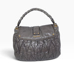 My Vintage Attire Miu Miu grey matelassé lambskin Coffer shoulder bag with gold-tone hardware and braided handle.