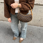 Louis Vuitton Croissant PM monogram canvas front worn
