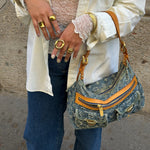 Model wearing a Louis Vuitton Denim Baggy Monogram shoulder bag, highlighting its iconic Y2K silhouette, signature denim canvas, and effortless luxury style.