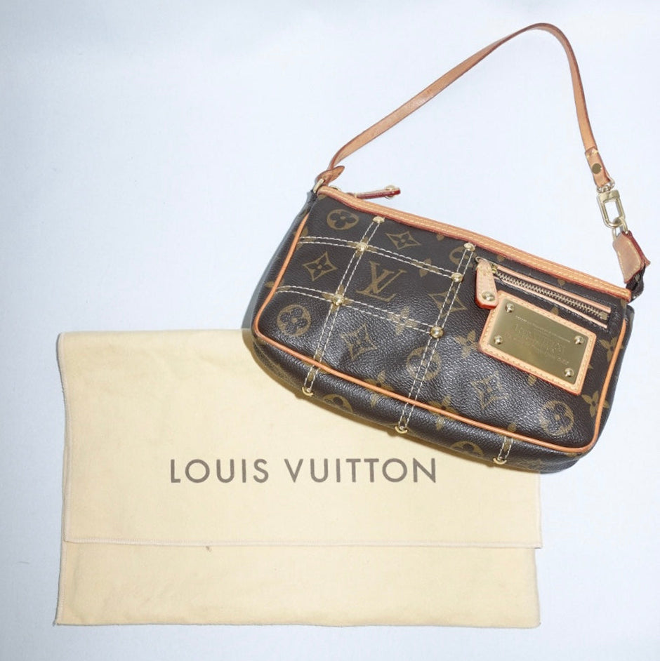 Vintage Louis Vuitton Limited Edition Monogram Pochette with leather details and gold-toned hardware