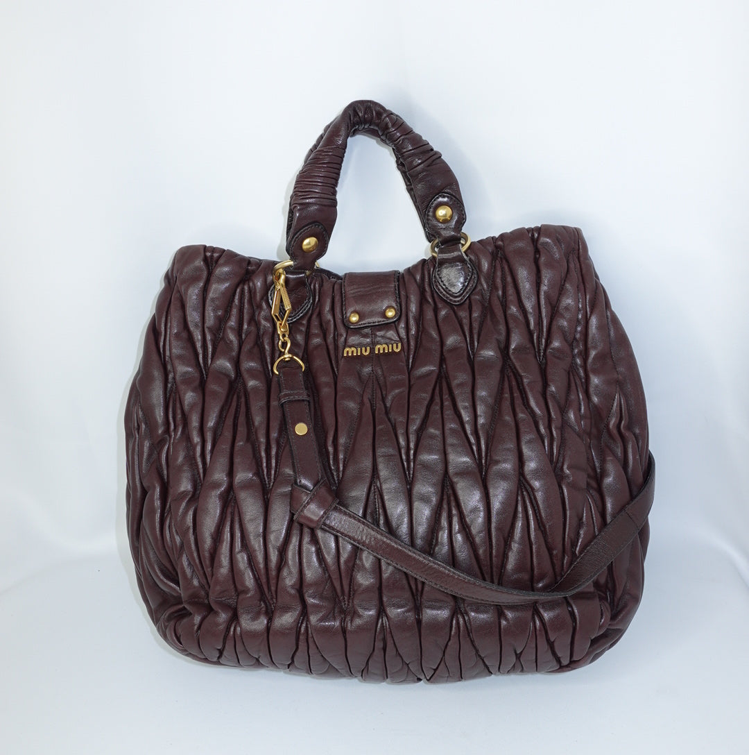 Miu Miu Burgundy Maxi Coffer Bag back view showing matelassé leather design