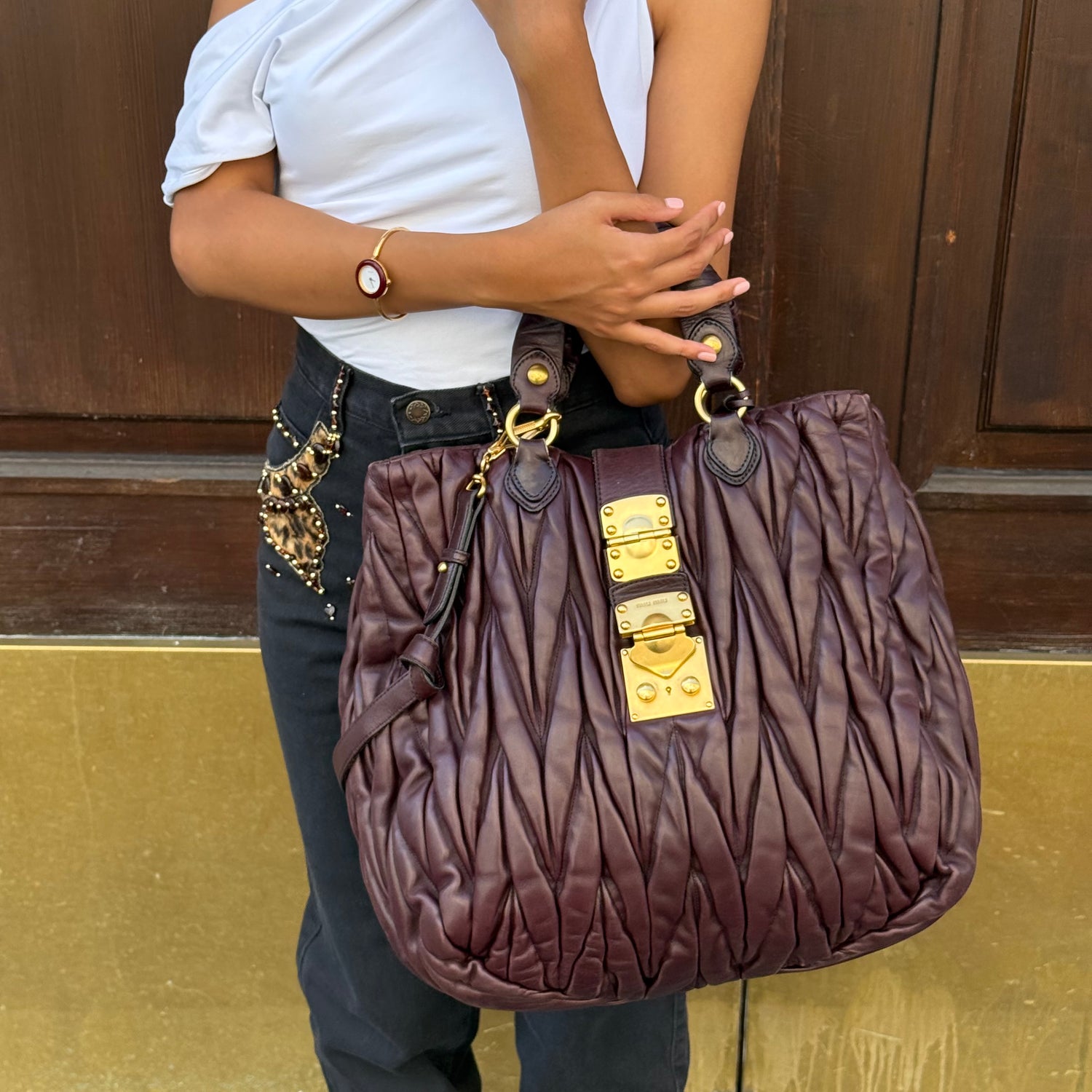 Miu Miu Burgundy Maxi Coffer Bag worn view showing size and fit