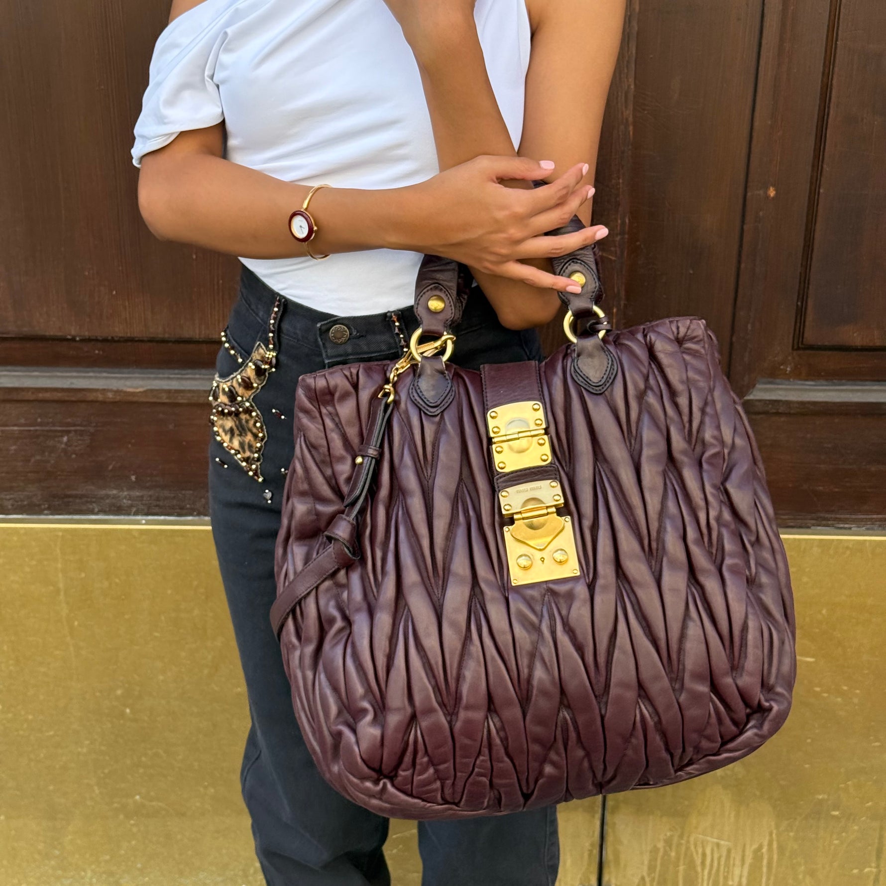 Miu Miu Burgundy Maxi Coffer Bag worn view showing size and fit