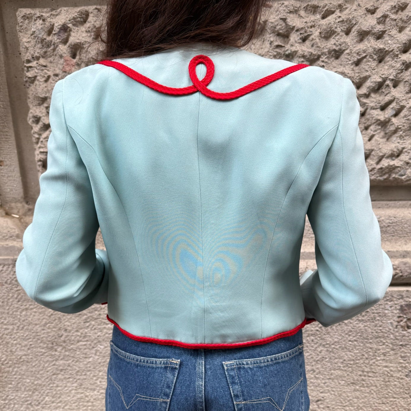 Back view of Moschino Cheap and Chic light blue cropped blazer featuring elegant red rope detailing and cropped design.