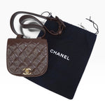 My Vintage Attire Chanel quilted chocolate brown caviar leather belt bag with gold CC logo and dust bag.