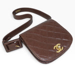 My Vintage Attire Chanel quilted chocolate brown caviar leather belt bag with gold CC logo and adjustable strap.