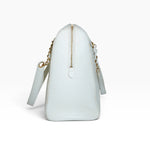 My Vintage Attire Chanel white caviar leather maxi tote bag side view with gold-toned zipper and chain strap detail.