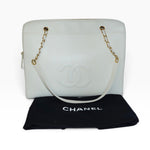 My Vintage Attire Chanel white caviar leather maxi tote bag with embossed CC logo and gold chain straps.
