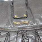 My Vintage Attire Miu Miu grey matelassé lambskin shoulder bag with gold-tone logo and hardware details.