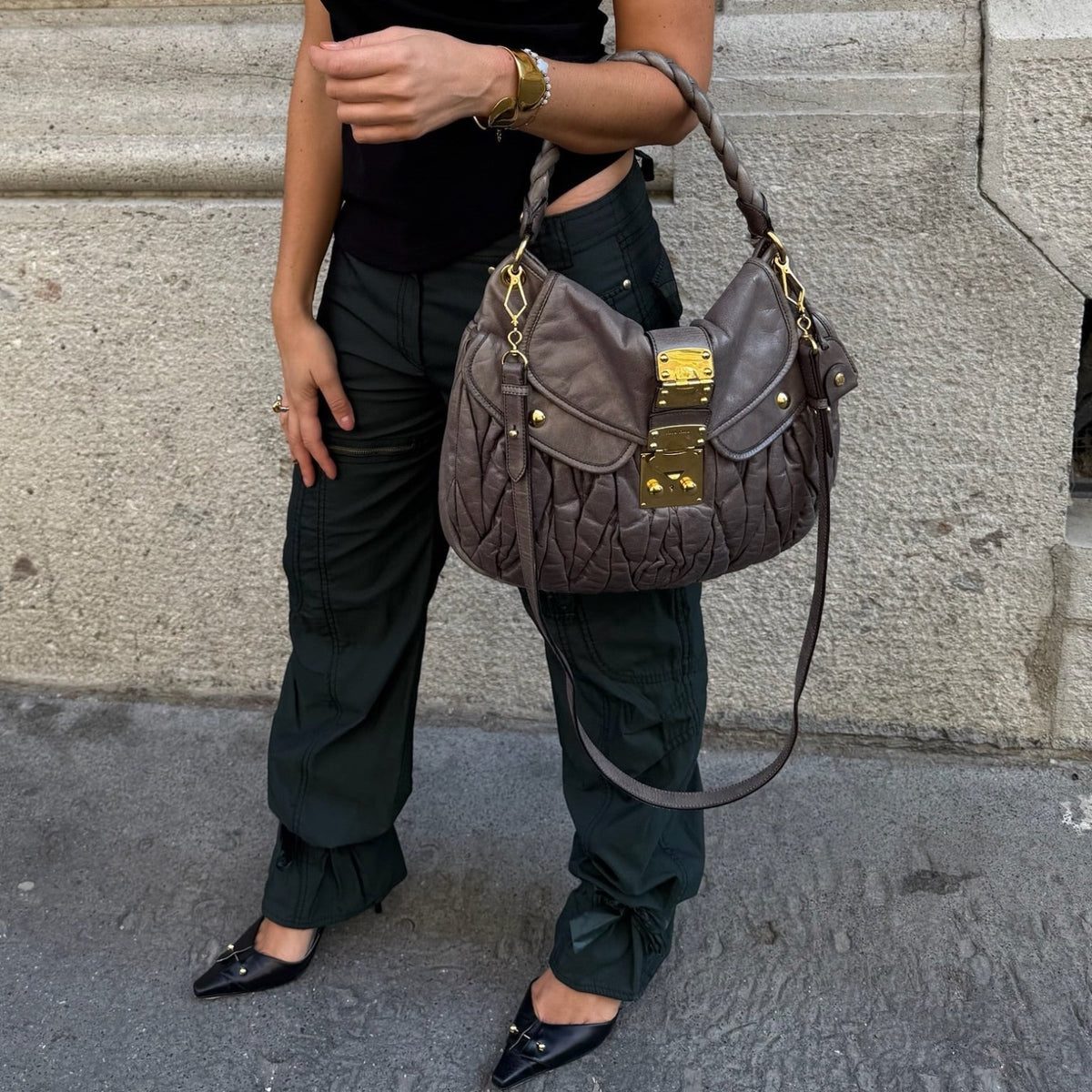 My Vintage Attire Miu Miu grey matelassé lambskin Coffer shoulder bag with gold hardware worn on shoulder