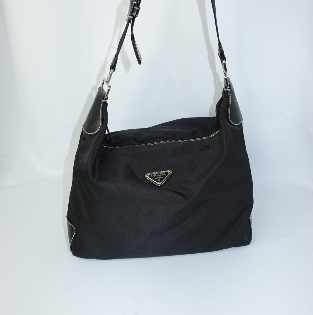     Prada Nylon Hobo Long Strap Bag front view featuring Prada logo