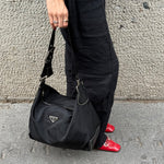     Prada Nylon Hobo Long Strap Bag worn side view showing shape and shoulder strap
