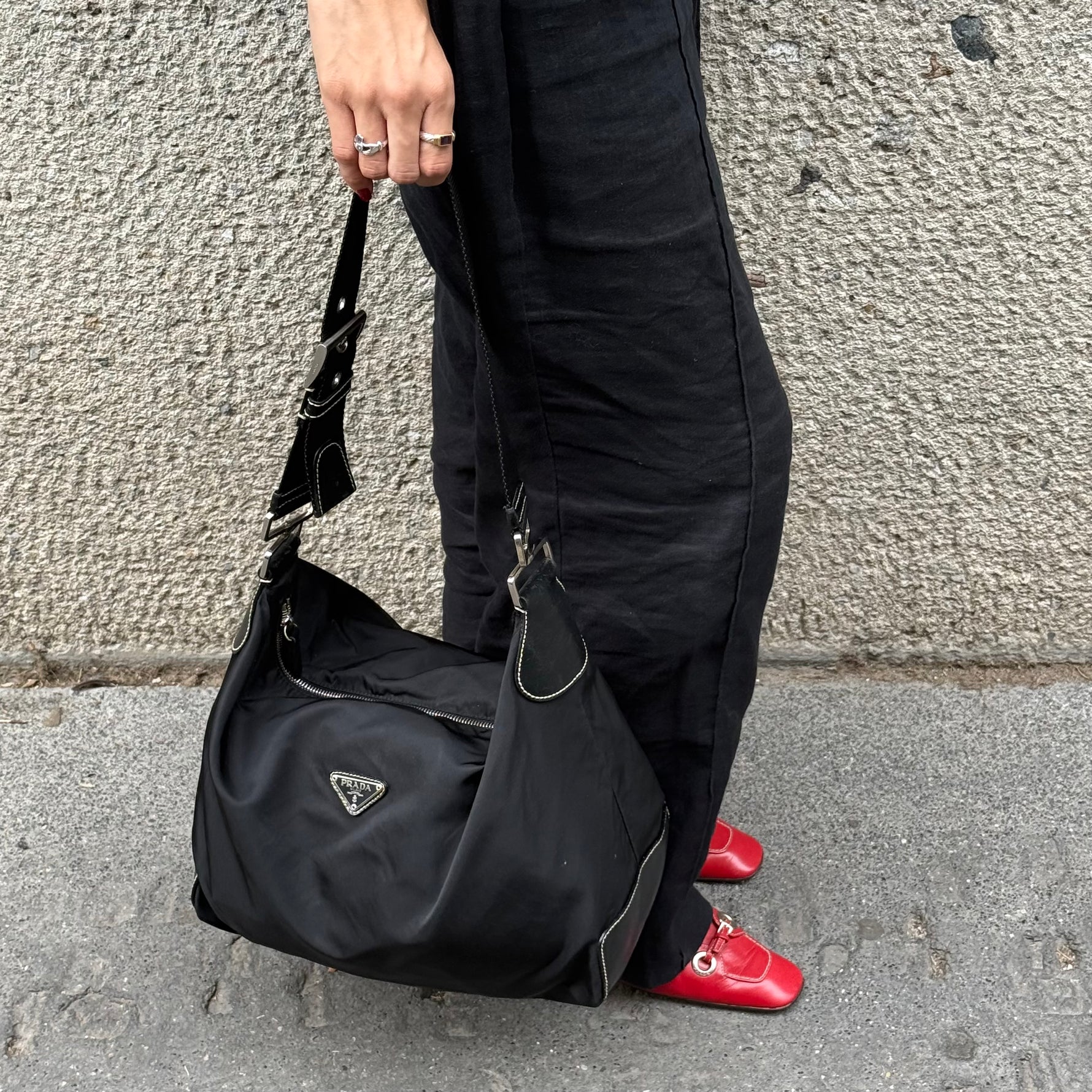     Prada Nylon Hobo Long Strap Bag worn side view showing shape and shoulder strap