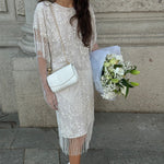 Vintage 1920s style white beaded fringe dress front view with intricate beadwork and flowing fringe detail