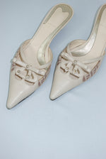 Vintage Fendi beige kitten heel mules close-up showing designer details
