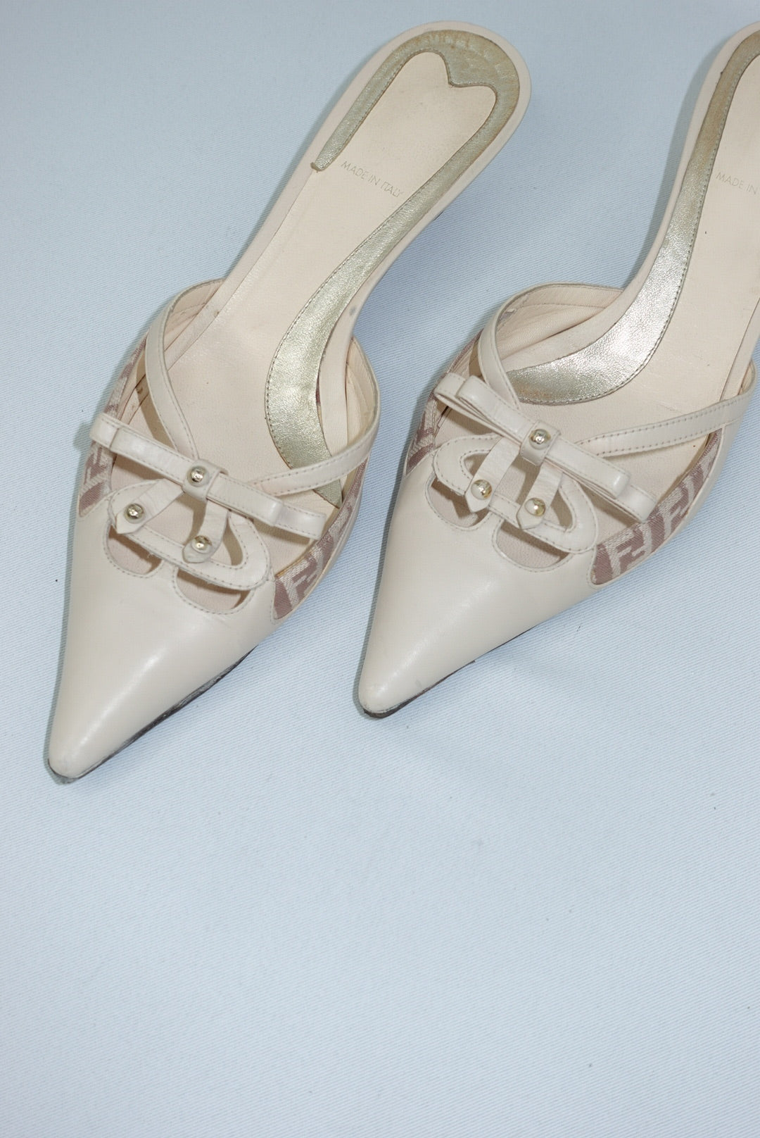 Vintage Fendi beige kitten heel mules close-up showing designer details