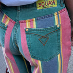 Close-up detail of the multicolor rainbow striped panel and vintage denim construction on the back of the mom jeans.