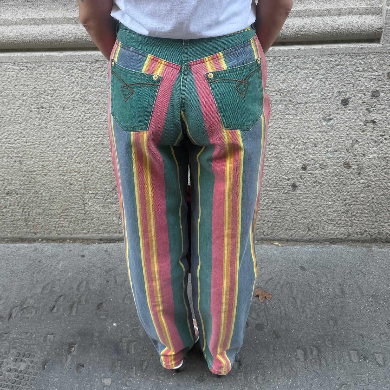 Front view of vintage green rainbow print straight jeans featuring a high-rise waist, straight-leg fit and classic five-pocket design.