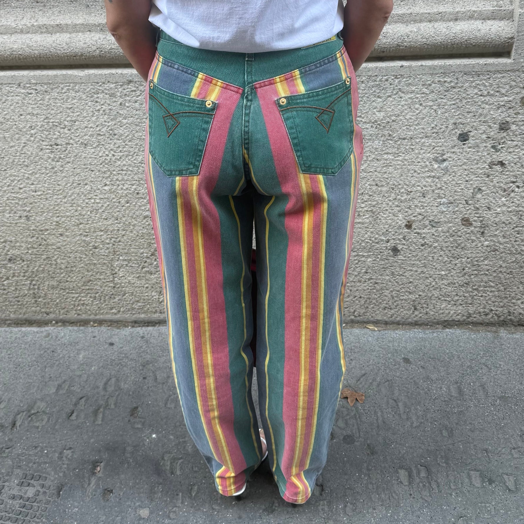 Front view of vintage green rainbow print straight jeans featuring a high-rise waist, straight-leg fit and classic five-pocket design.