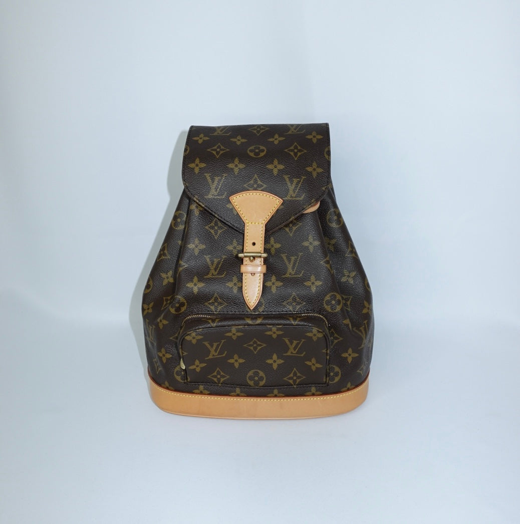 Vintage Louis Vuitton Monogram canvas backpack front still life view with signature leather details