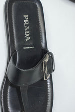 Vintage Prada black leather sandals worn view showing fit and minimalist silhouette