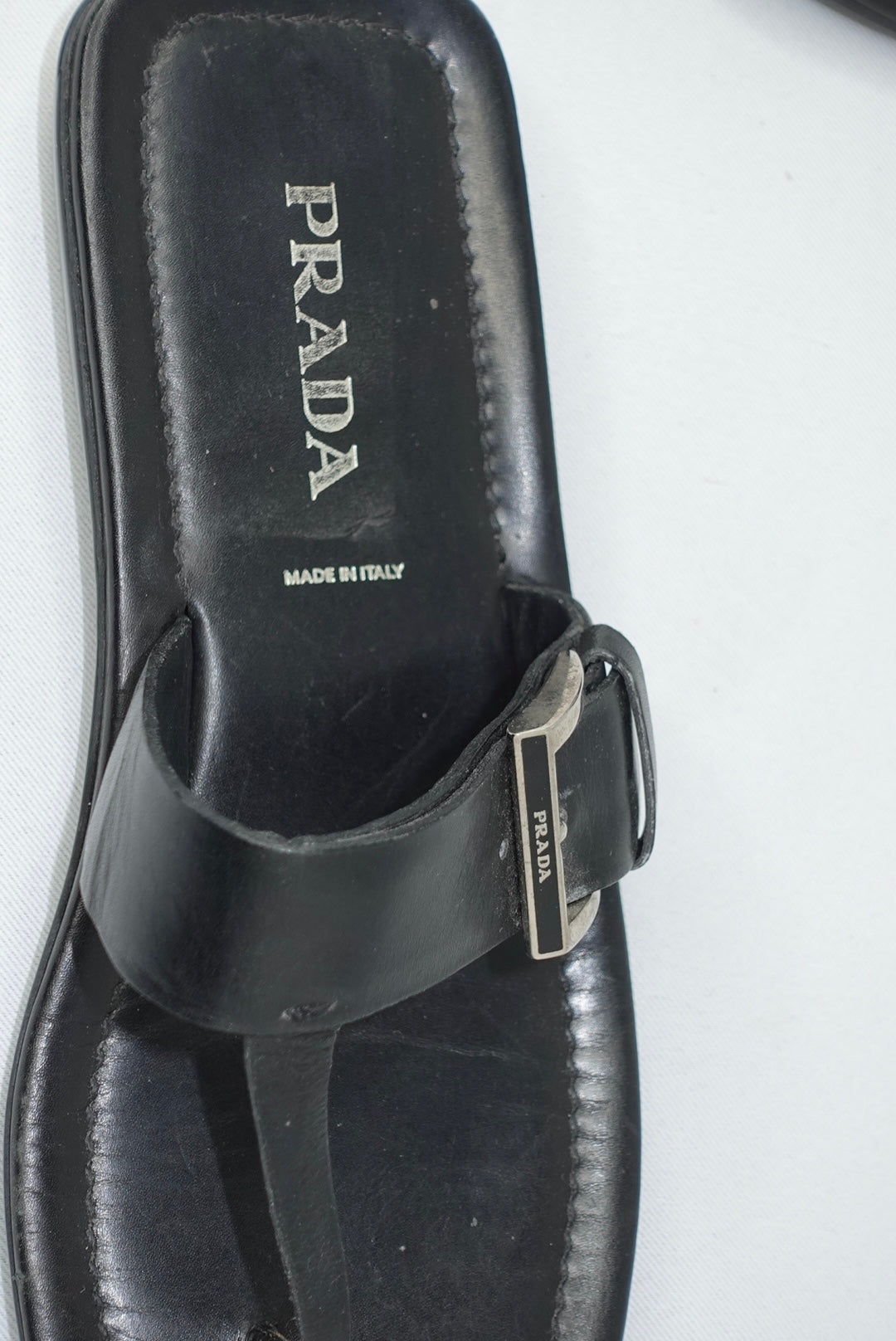 Vintage Prada black leather sandals worn view showing fit and minimalist silhouette