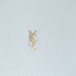 YSL vintage gold logo brooch front view