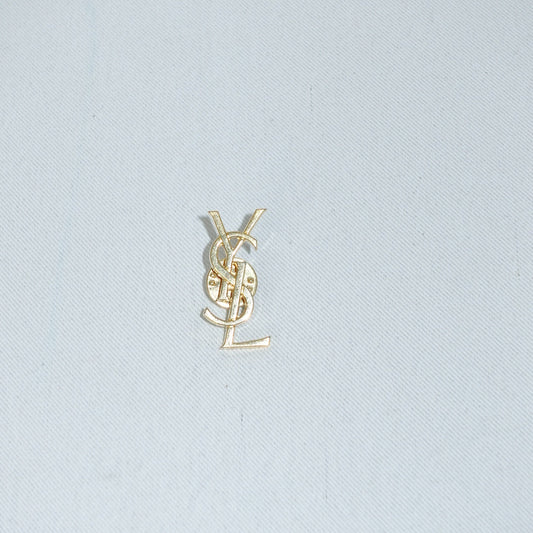 YSL vintage gold logo brooch front view